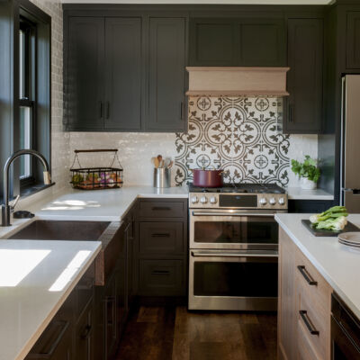 PERIMETER: Wood: Maple; Paint color: Black of Night; Door Style: Exeter; Face Frame: Square Inset; ISLAND: Wood: Cherry; Finish: Summer Haze; Door Style: Exeter; Face Frame: Square Inset
(NOTE: RANGE HOOD CRAFTED FROM CROWN POINT LINE) PERIMETER: Wood: Maple; Paint color: Black of Night; Door Style: Exeter; Face Frame: Square Inset; ISLAND: Wood: Cherry; Finish: Summer Haze; Door Style: Exeter; Face Frame: Square Inset (NOTE: RANGE HOOD CRAFTED FROM CROWN POINT LINE)