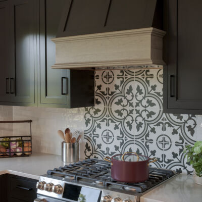 PERIMETER: Wood: Maple; Paint color: Black of Night; Door Style: Exeter; Face Frame: Square Inset; ISLAND: Wood: Cherry; Finish: Summer Haze; Door Style: Exeter; Face Frame: Square Inset
(NOTE: RANGE HOOD CRAFTED FROM CROWN POINT LINE) PERIMETER: Wood: Maple; Paint color: Black of Night; Door Style: Exeter; Face Frame: Square Inset; ISLAND: Wood: Cherry; Finish: Summer Haze; Door Style: Exeter; Face Frame: Square Inset (NOTE: RANGE HOOD CRAFTED FROM CROWN POINT LINE)