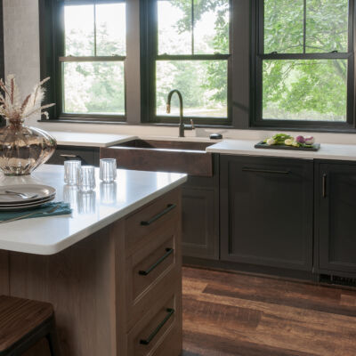 PERIMETER: Wood: Maple; Paint color: Black of Night; Door Style: Exeter; Face Frame: Square Inset; ISLAND: Wood: Cherry; Finish: Summer Haze; Door Style: Exeter; Face Frame: Square Inset
(NOTE: RANGE HOOD CRAFTED FROM CROWN POINT LINE) PERIMETER: Wood: Maple; Paint color: Black of Night; Door Style: Exeter; Face Frame: Square Inset; ISLAND: Wood: Cherry; Finish: Summer Haze; Door Style: Exeter; Face Frame: Square Inset (NOTE: RANGE HOOD CRAFTED FROM CROWN POINT LINE)