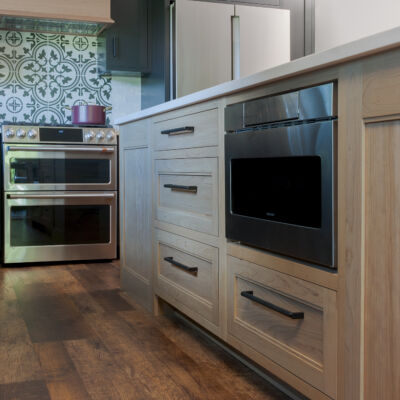 PERIMETER: Wood: Maple; Paint color: Black of Night; Door Style: Exeter; Face Frame: Square Inset; ISLAND: Wood: Cherry; Finish: Summer Haze; Door Style: Exeter; Face Frame: Square Inset
(NOTE: RANGE HOOD CRAFTED FROM CROWN POINT LINE) PERIMETER: Wood: Maple; Paint color: Black of Night; Door Style: Exeter; Face Frame: Square Inset; ISLAND: Wood: Cherry; Finish: Summer Haze; Door Style: Exeter; Face Frame: Square Inset (NOTE: RANGE HOOD CRAFTED FROM CROWN POINT LINE)