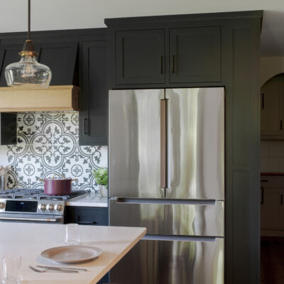 PERIMETER: Wood: Maple; Paint color: Black of Night; Door Style: Exeter; Face Frame: Square Inset; ISLAND: Wood: Cherry; Finish: Summer Haze; Door Style: Exeter; Face Frame: Square Inset
(NOTE: RANGE HOOD CRAFTED FROM CROWN POINT LINE) PERIMETER: Wood: Maple; Paint color: Black of Night; Door Style: Exeter; Face Frame: Square Inset; ISLAND: Wood: Cherry; Finish: Summer Haze; Door Style: Exeter; Face Frame: Square Inset (NOTE: RANGE HOOD CRAFTED FROM CROWN POINT LINE)