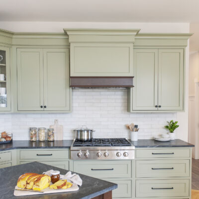 PERIMETER: Wood: Maple; Paint color: Green Earth; Door Style: Cornish; Face Frame: Beaded Inset; ISLAND: Wood: Cherry; Finish: Chestnut; Door Style: Cornish; Face Frame: Beaded Inset (NOTE: RANGE HOOD CRAFTED FROM CROWN POINT LINE)